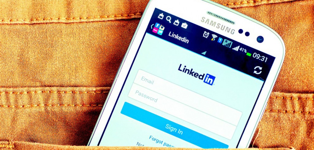 LinkedIn Profile Tips: Are You Ticking the Right Boxes? Phone with LinkedIn profile tips